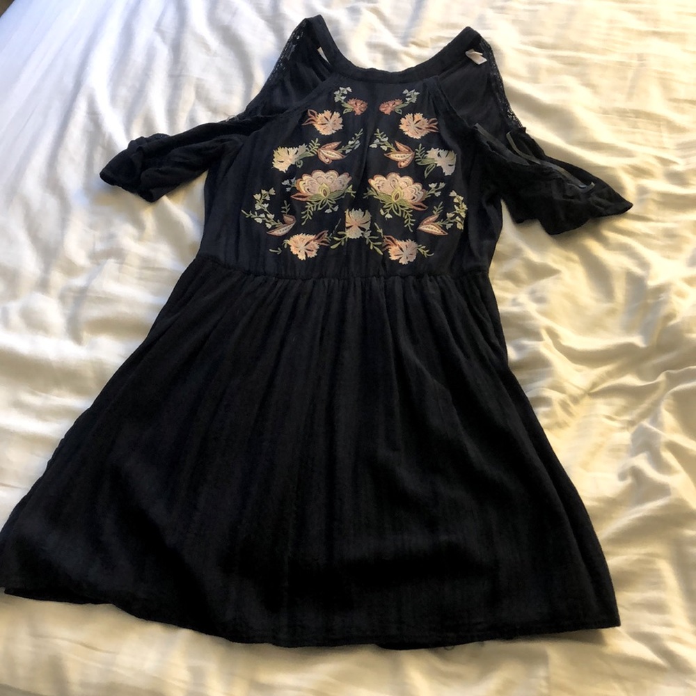 Navy dress with flower details on bodice